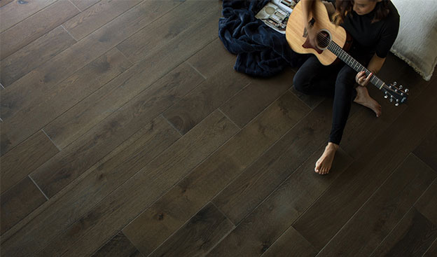 Lady with guitar | Vallow Floor Coverings, Inc.